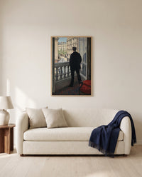 Young Man at His Window by Gustave Caillebotte framed in natural oak above a cream sofa in a warm living room