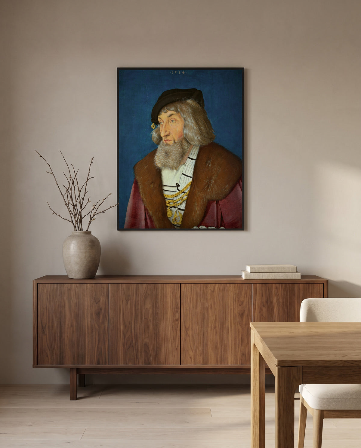 Portrait of a Man by Hans Baldung Grien in a black frame above a walnut sideboard in a dining room