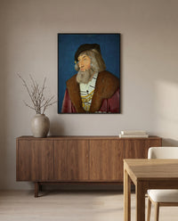 Portrait of a Man by Hans Baldung Grien in a black frame above a walnut sideboard in a dining room