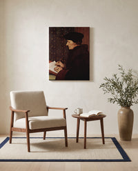 Erasmus Writing by Hans Holbein the Younger as a stretched canvas above a linen lounge chair in a reading corner