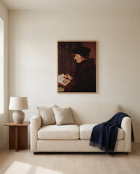 Erasmus Writing by Hans Holbein the Younger framed in natural oak above a cream sofa in a warm living room