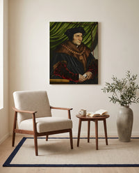 Sir Thomas More by Hans Holbein the Younger as a stretched canvas above a linen lounge chair in a reading corner