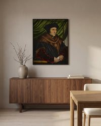 Sir Thomas More by Hans Holbein the Younger in a black frame above a walnut sideboard in a dining room