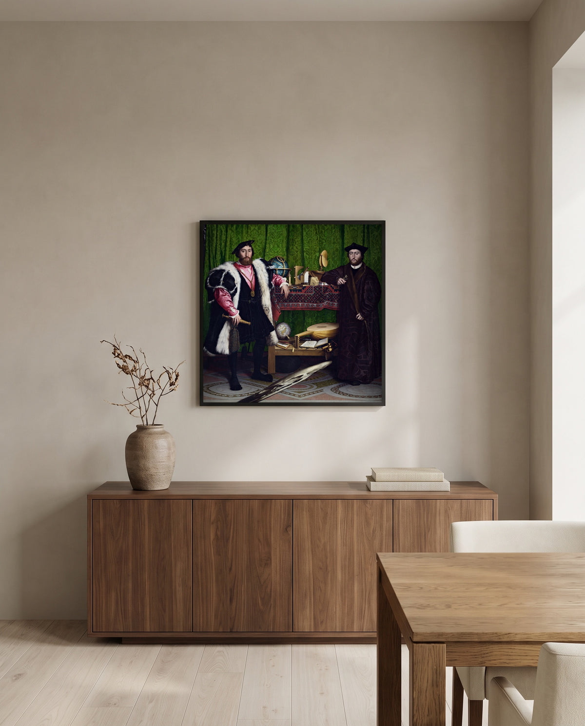 The Ambassadors by Hans Holbein the Younger in a black frame above a walnut sideboard in a dining room
