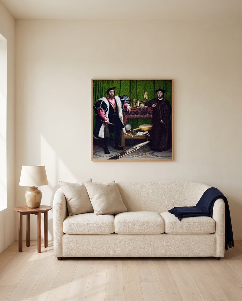 The Ambassadors by Hans Holbein the Younger framed in natural oak above a cream sofa in a warm living room