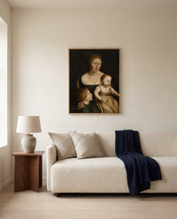 The Artist’s Family by Hans Holbein the Younger framed in natural oak above a cream sofa in a warm living room