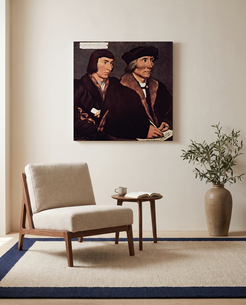 Thomas Godsalve and Son by Hans Holbein the Younger as a stretched canvas above a linen lounge chair in a reading corner