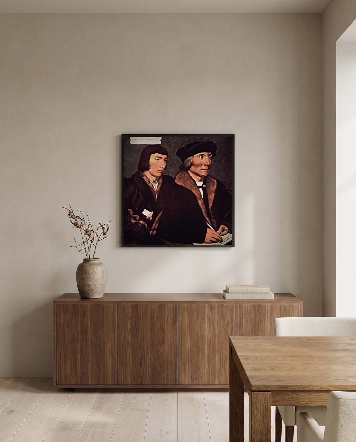 Thomas Godsalve and Son by Hans Holbein the Younger in a black frame above a walnut sideboard in a dining room
