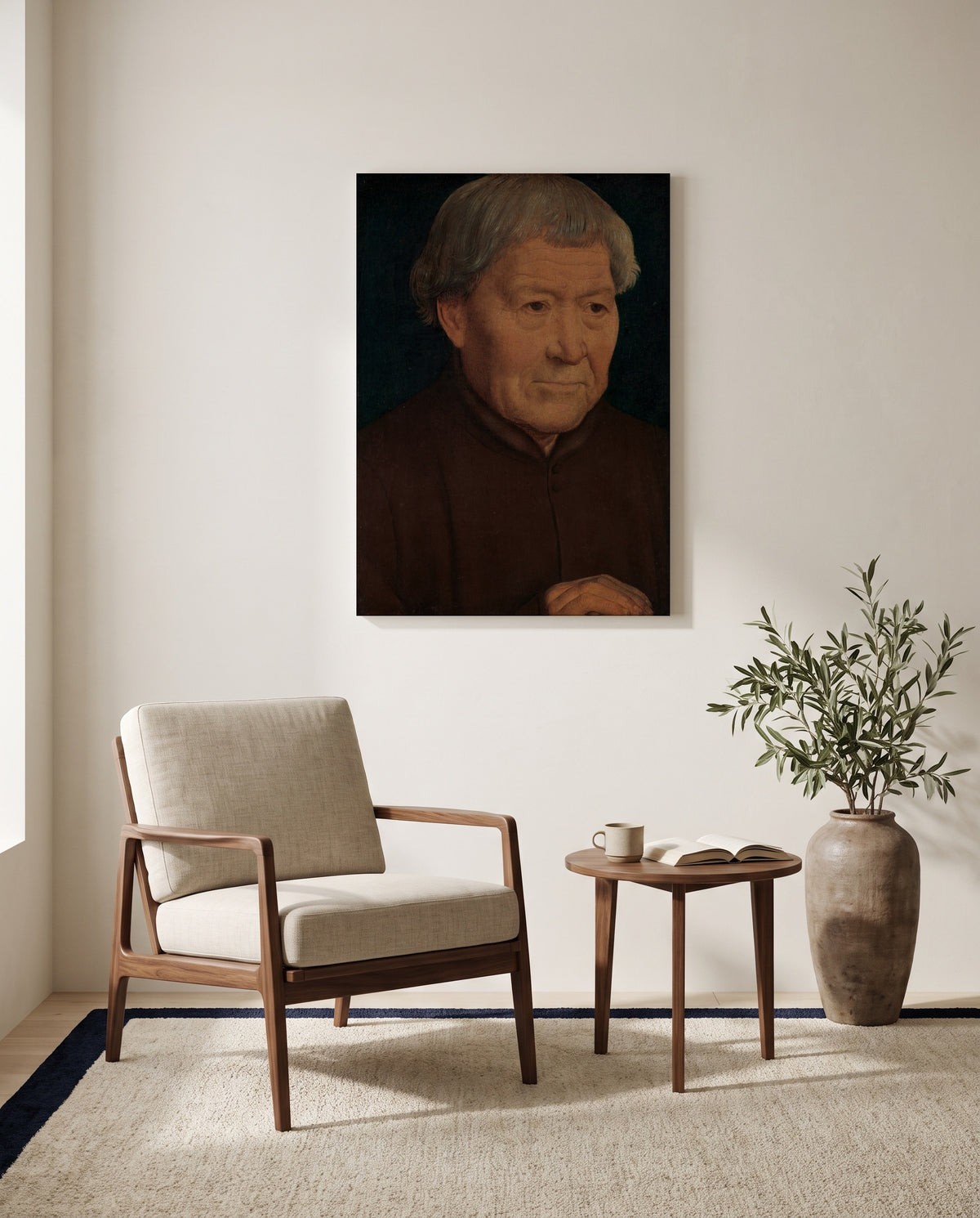 Old Man by Hans Memling as a stretched canvas above a linen lounge chair in a reading corner