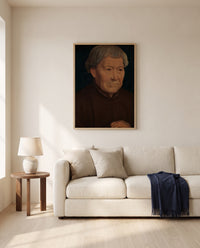 Old Man by Hans Memling framed in natural oak above a cream sofa in a warm living room