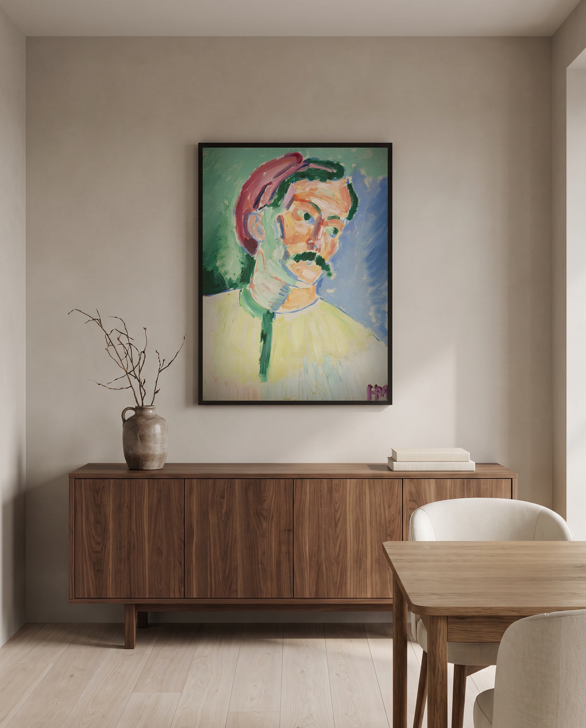 André Derain by Henri Matisse in a black frame above a walnut sideboard in a dining room