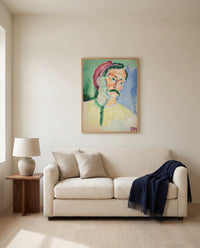 André Derain by Henri Matisse framed in natural oak above a cream sofa in a warm living room