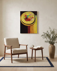 Apples by Henri Matisse as a stretched canvas above a linen lounge chair in a reading corner