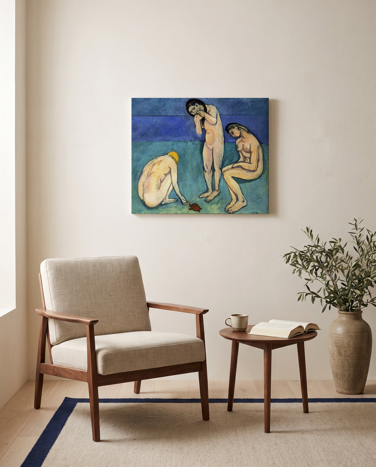 Bathers with a Turtle by Henri Matisse as a stretched canvas above a linen lounge chair in a reading corner