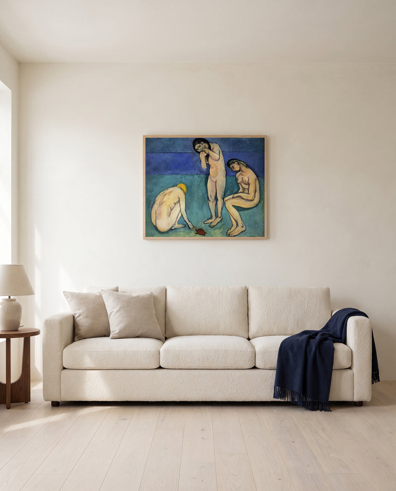 Bathers with a Turtle by Henri Matisse framed in natural oak above a cream sofa in a warm living room