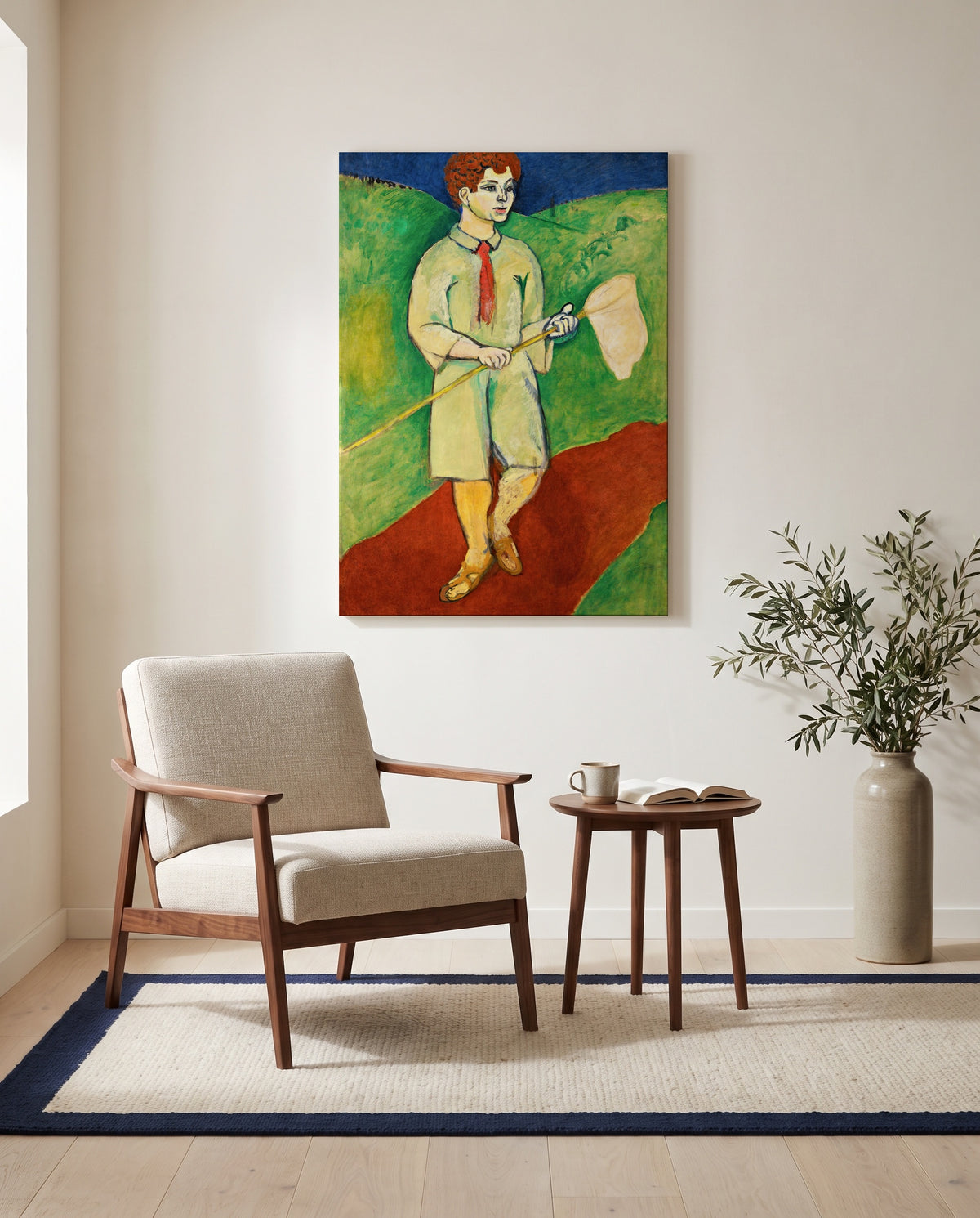 Boy with Butterfly Net by Henri Matisse as a stretched canvas above a linen lounge chair in a reading corner
