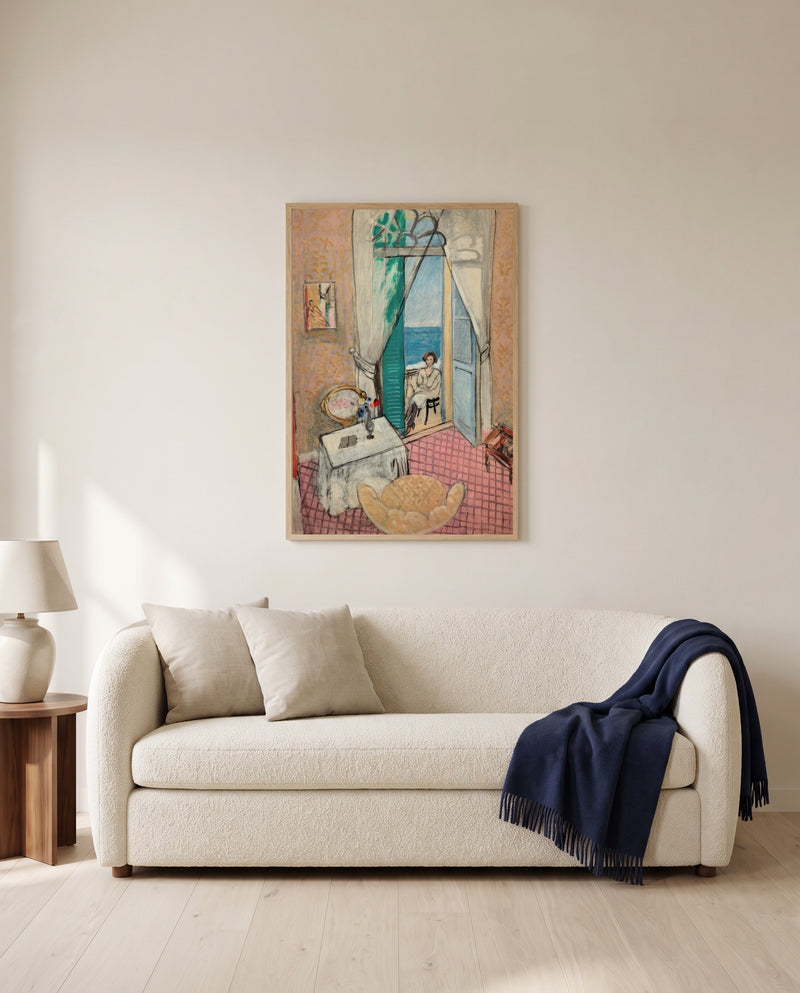 Interior at Nice by Henri Matisse framed in natural oak above a cream sofa in a warm living room