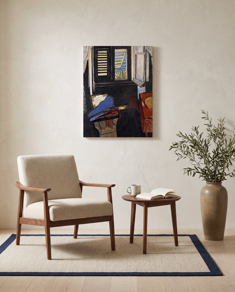 Interior with a Violin by Henri Matisse as a stretched canvas above a linen lounge chair in a reading corner