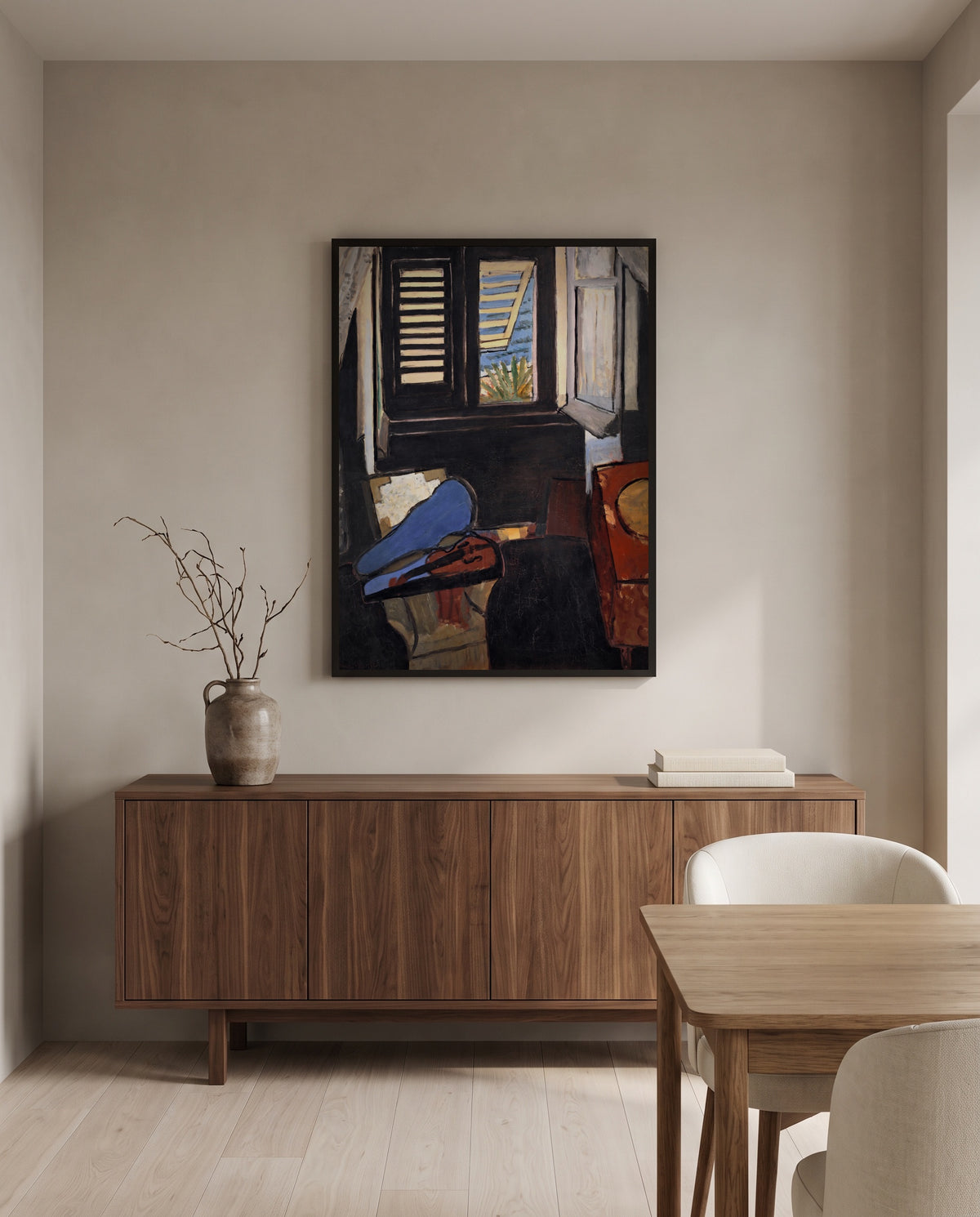 Interior with a Violin by Henri Matisse in a black frame above a walnut sideboard in a dining room