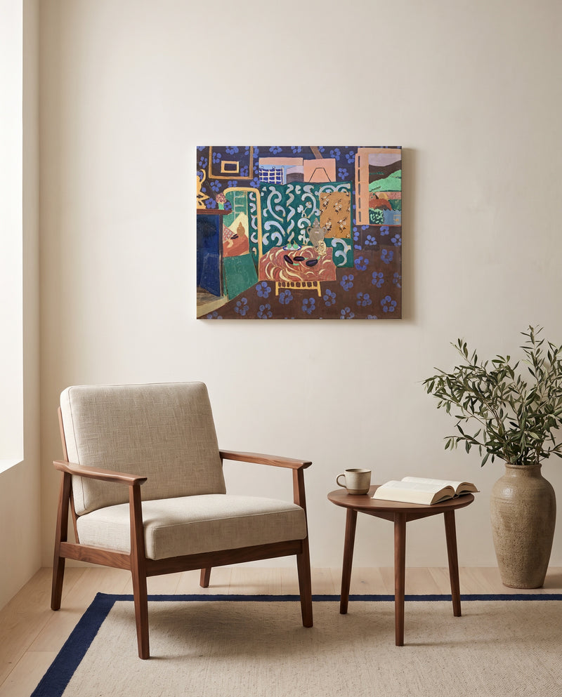 Interior with Aubergines by Henri Matisse as a stretched canvas above a linen lounge chair in a reading corner