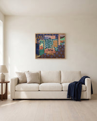Interior with Aubergines by Henri Matisse framed in natural oak above a cream sofa in a warm living room