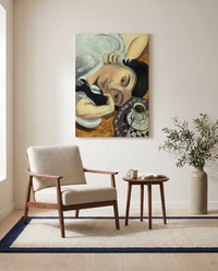 Laurette with Coffee by Henri Matisse as a stretched canvas above a linen lounge chair in a reading corner