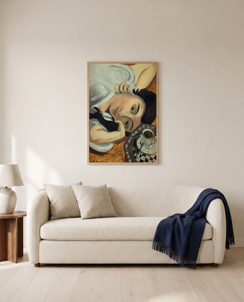 Laurette with Coffee by Henri Matisse framed in natural oak above a cream sofa in a warm living room