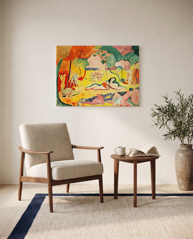 The Joy of Life by Henri Matisse as a stretched canvas above a linen lounge chair in a reading corner