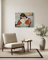 Marguerite Reading by Henri Matisse as a stretched canvas above a linen lounge chair in a reading corner