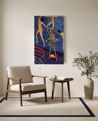 Nasturtiums with The Dance by Henri Matisse as a stretched canvas above a linen lounge chair in a reading corner