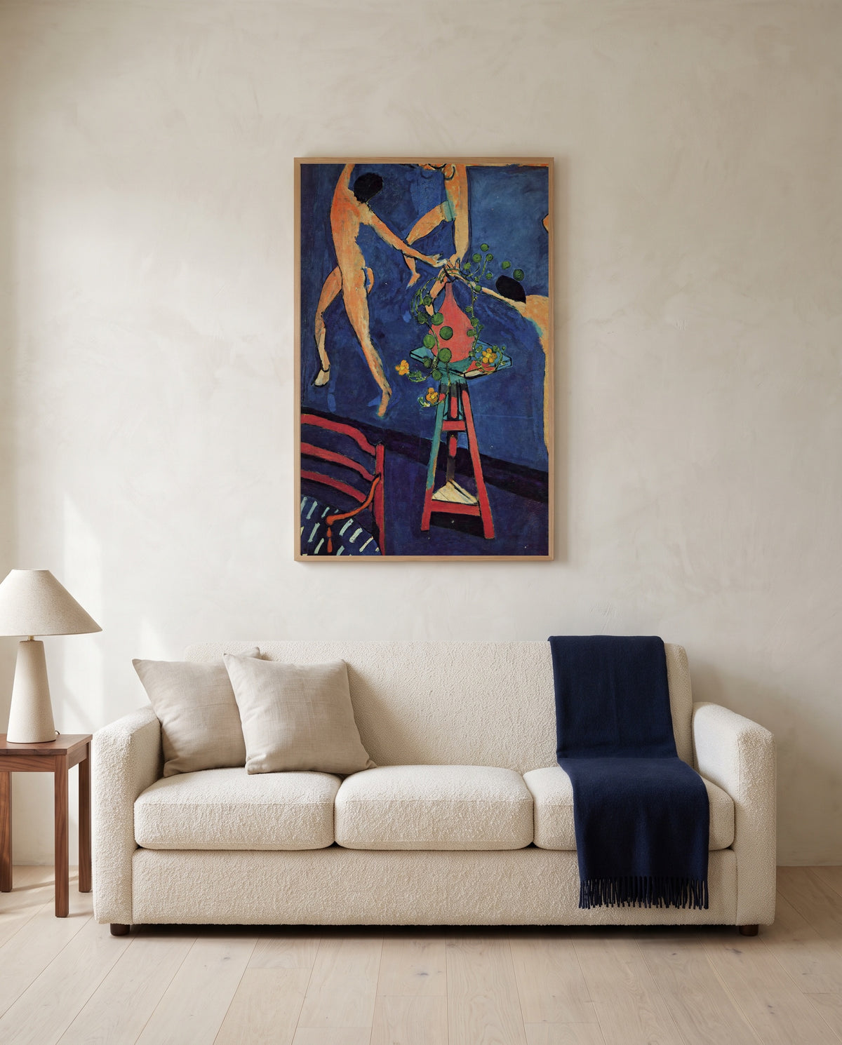 Nasturtiums with The Dance by Henri Matisse framed in natural oak above a cream sofa in a warm living room
