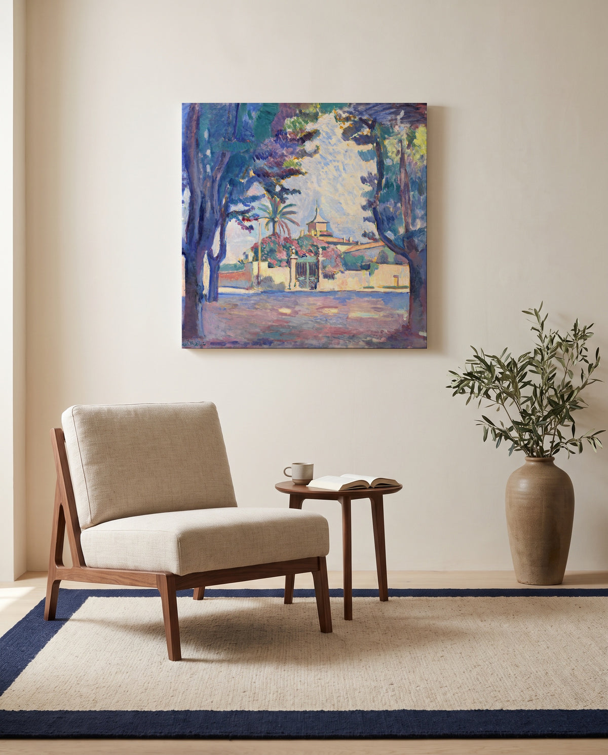 Place des Lices by Henri Matisse as a stretched canvas above a linen lounge chair in a reading corner