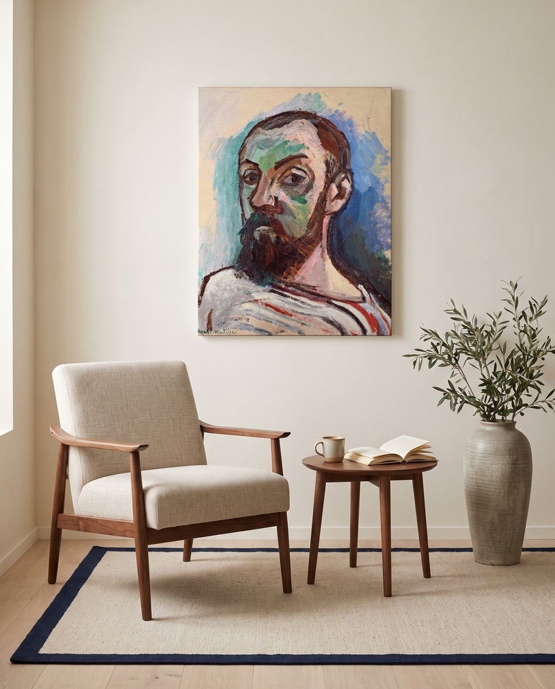 Self-Portrait (1906) by Henri Matisse as a stretched canvas above a linen lounge chair in a reading corner