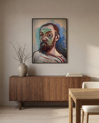 Self-Portrait (1906) by Henri Matisse in a black frame above a walnut sideboard in a dining room