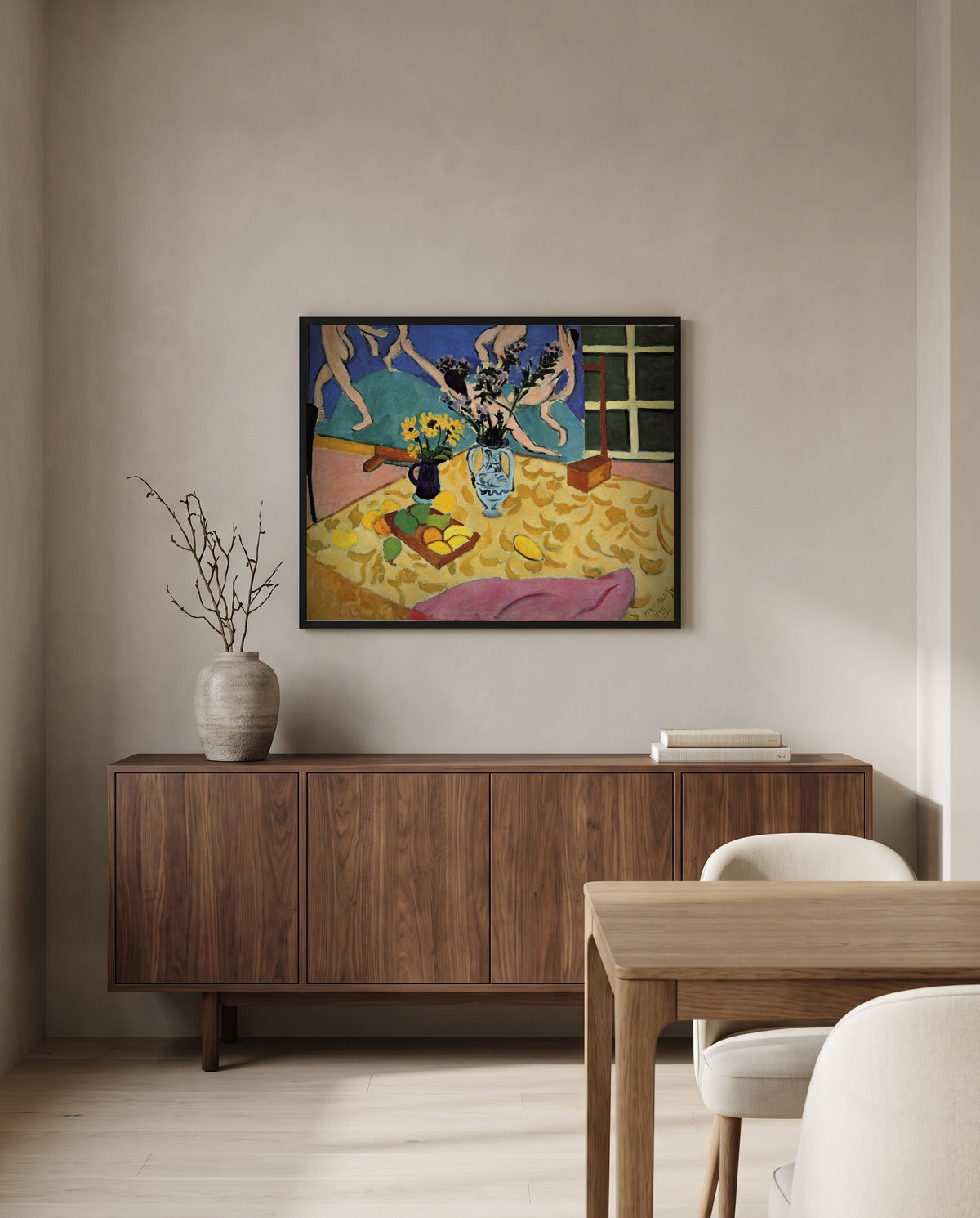 Still Life with Dance by Henri Matisse in a black frame above a walnut sideboard in a dining room