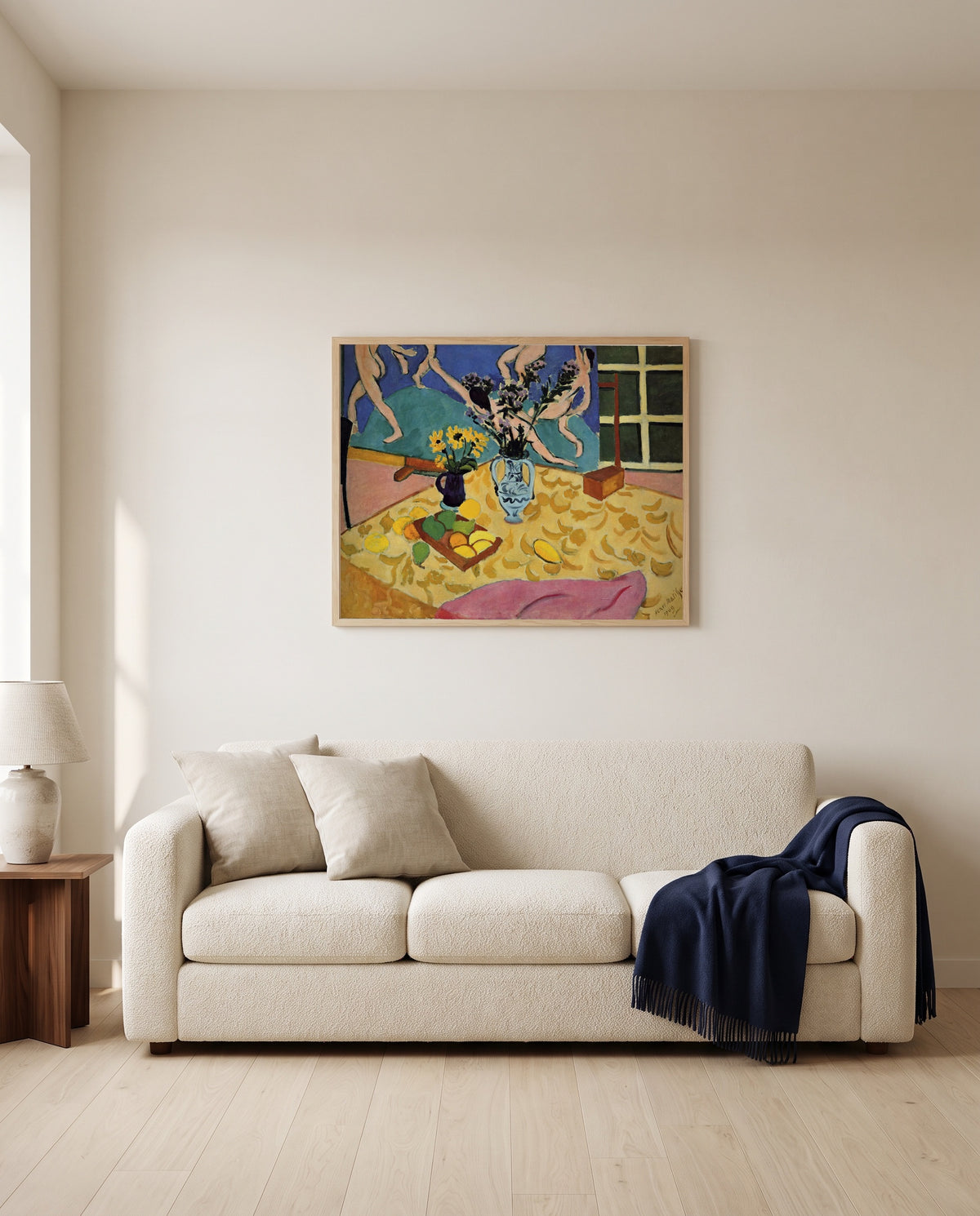 Still Life with Dance by Henri Matisse framed in natural oak above a cream sofa in a warm living room