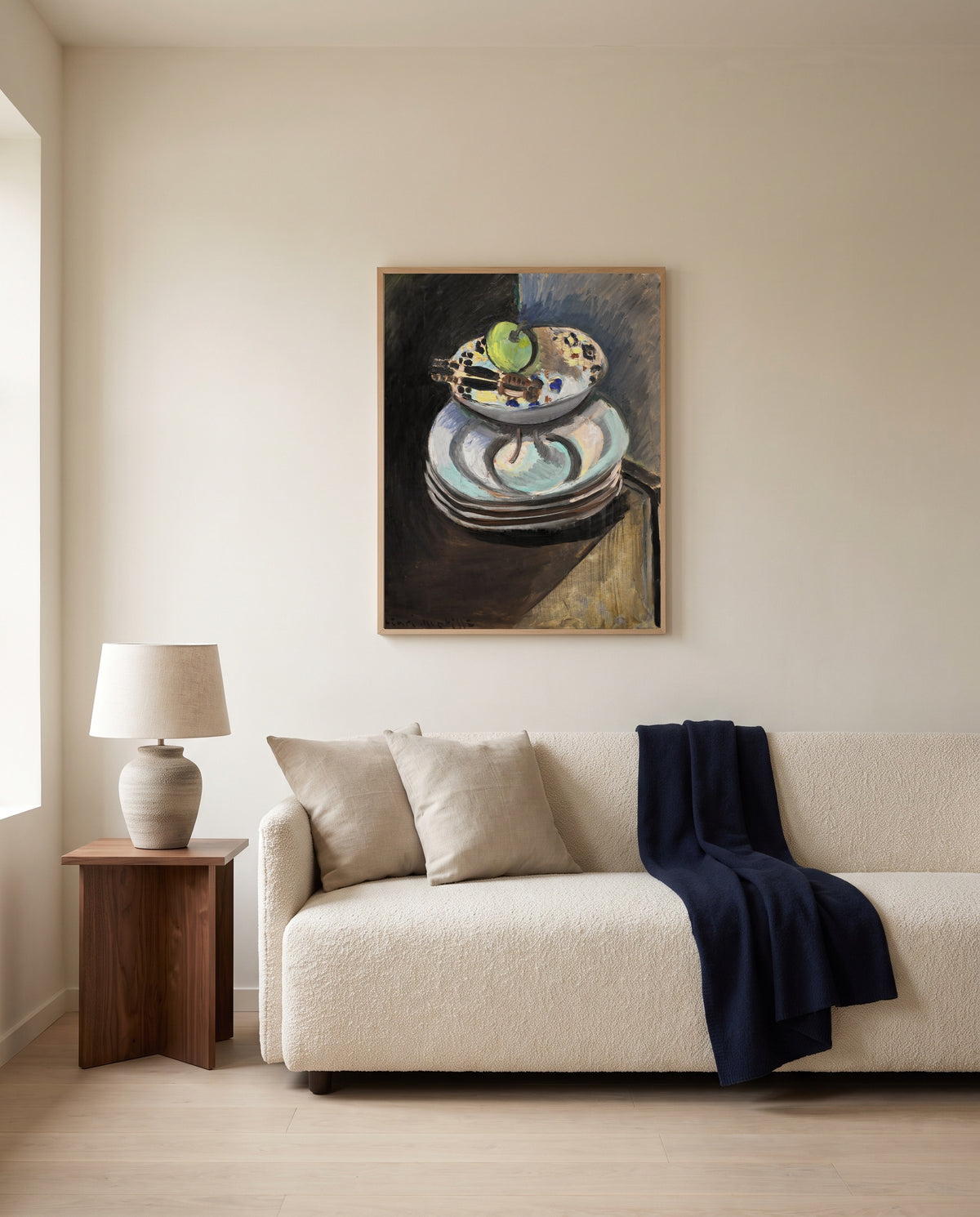 Fruit Bowl and Nutcracker by Henri Matisse framed in natural oak above a cream sofa in a warm living room