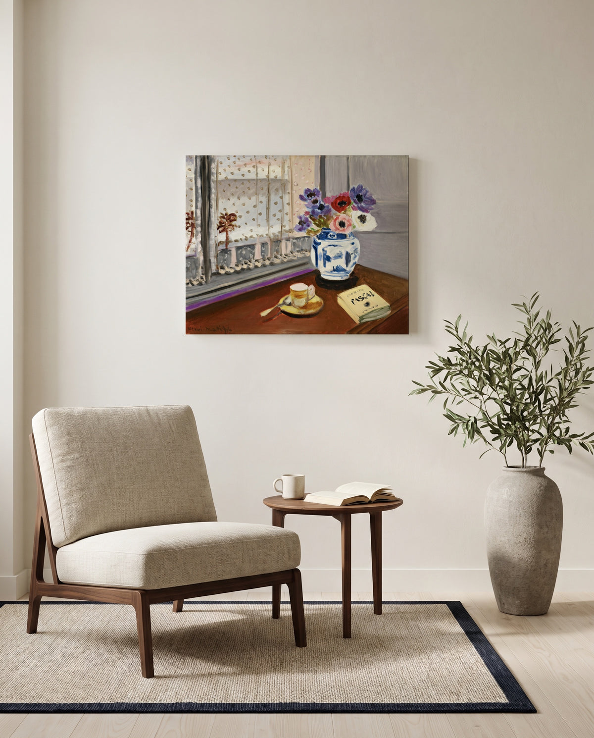 Still Life with Pascal by Henri Matisse as a stretched canvas above a linen lounge chair in a reading corner