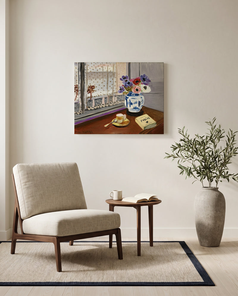 Still Life with Pascal by Henri Matisse as a stretched canvas above a linen lounge chair in a reading corner