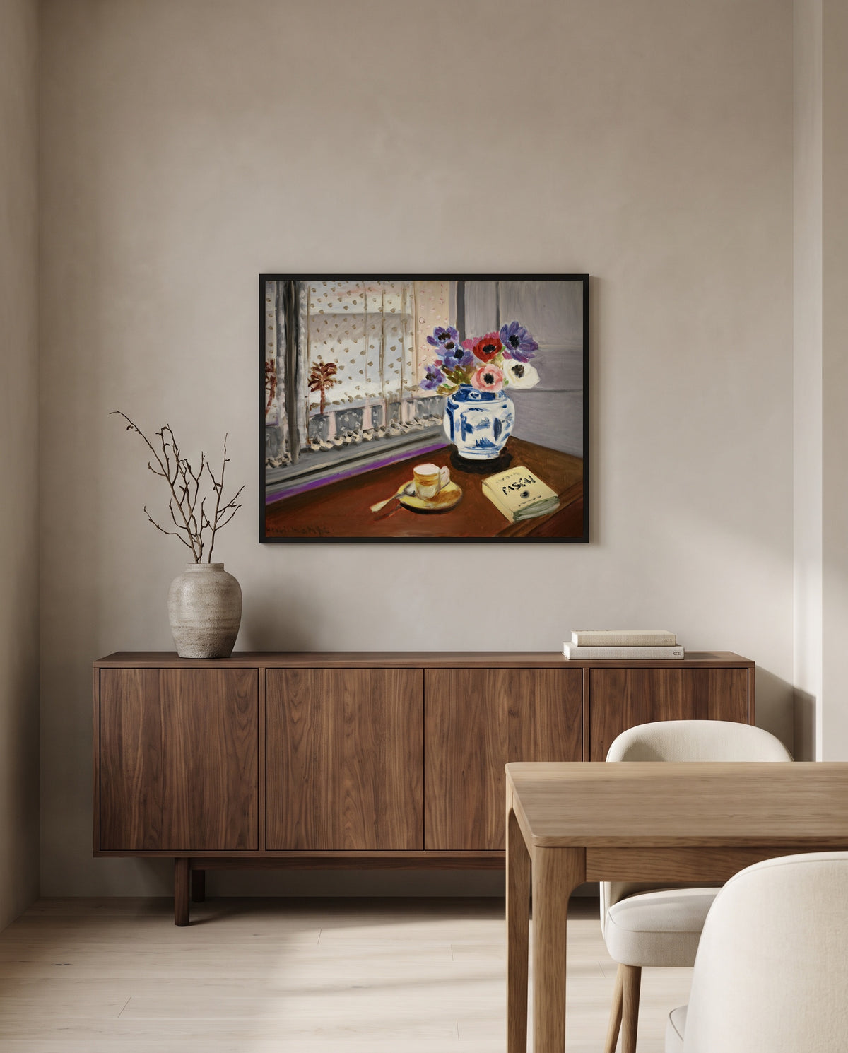 Still Life with Pascal by Henri Matisse in a black frame above a walnut sideboard in a dining room