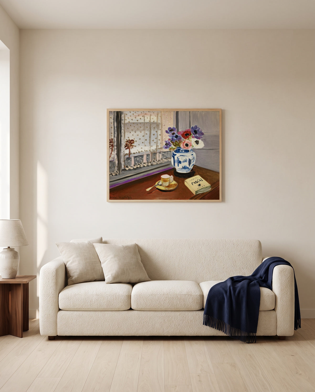 Still Life with Pascal by Henri Matisse framed in natural oak above a cream sofa in a warm living room