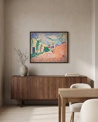 Street in Biskra by Henri Matisse in a black frame above a walnut sideboard in a dining room