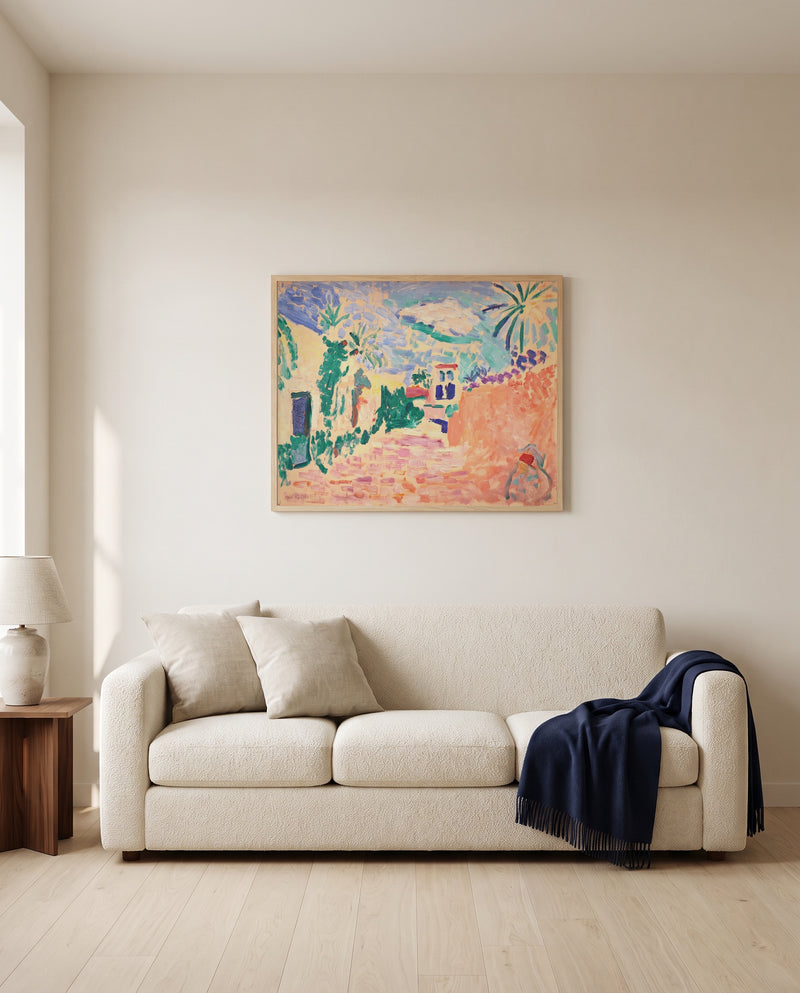 Street in Biskra by Henri Matisse framed in natural oak above a cream sofa in a warm living room