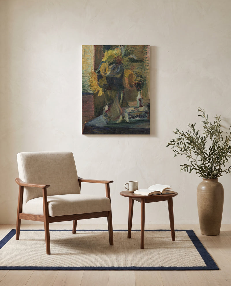 Sunflowers in a Vase by Henri Matisse as a stretched canvas above a linen lounge chair in a reading corner