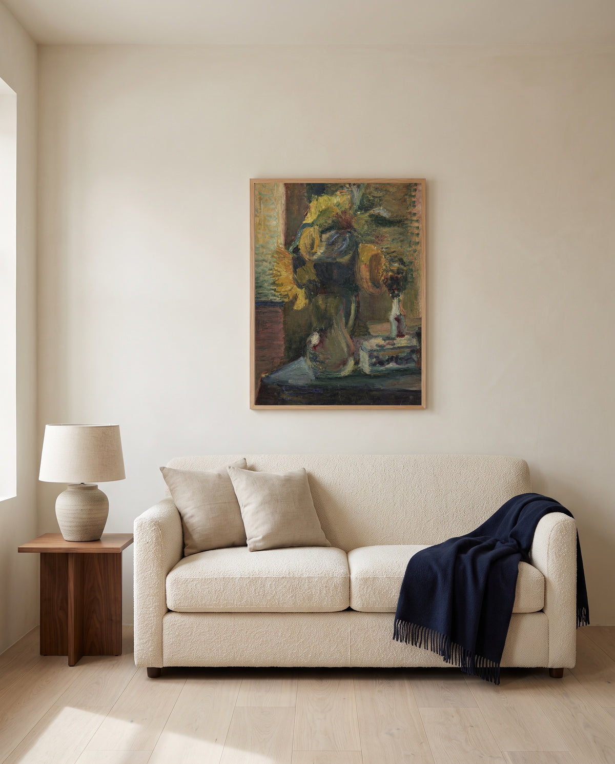 Sunflowers in a Vase by Henri Matisse framed in natural oak above a cream sofa in a warm living room