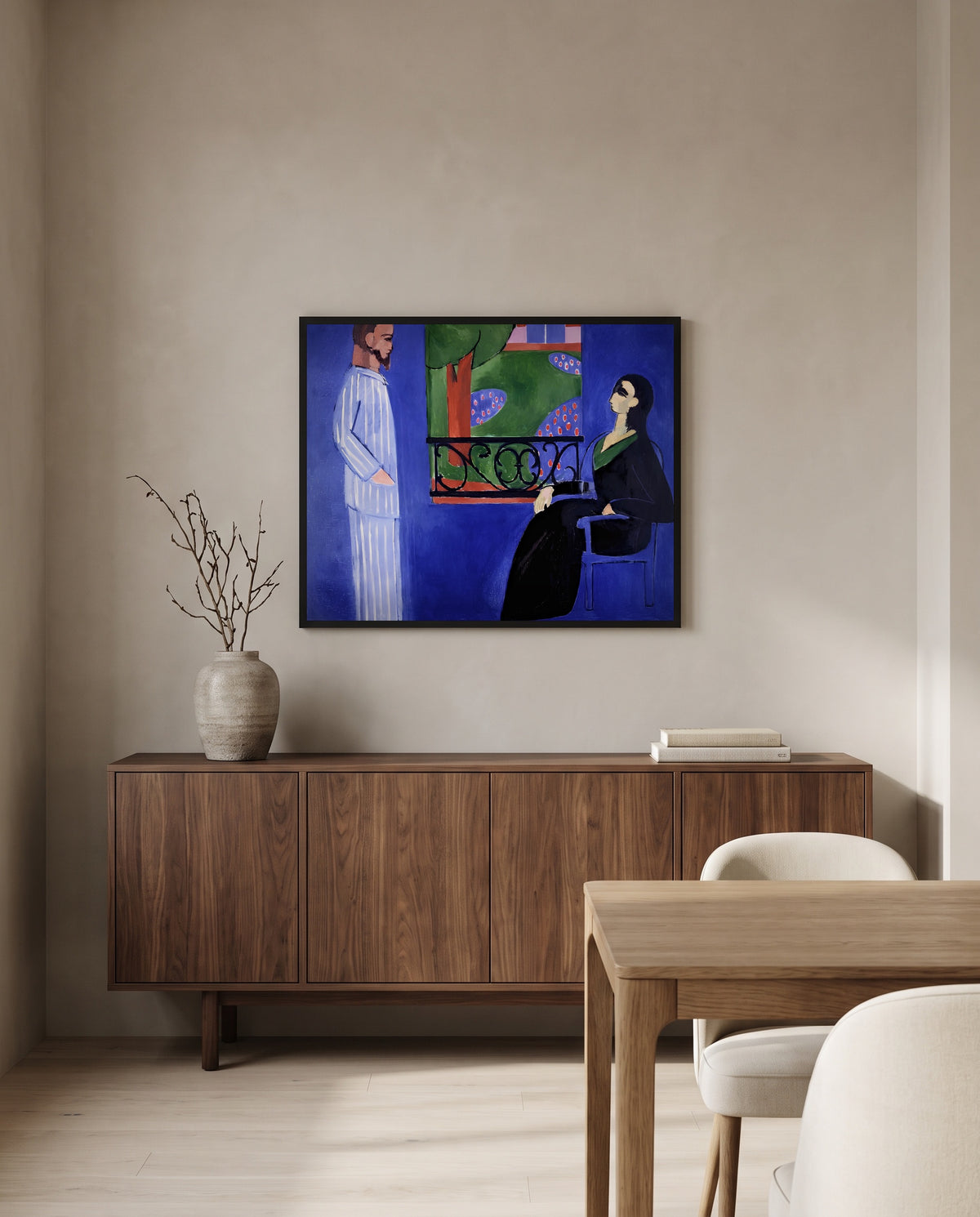 The Conversation by Henri Matisse in a black frame above a walnut sideboard in a dining room