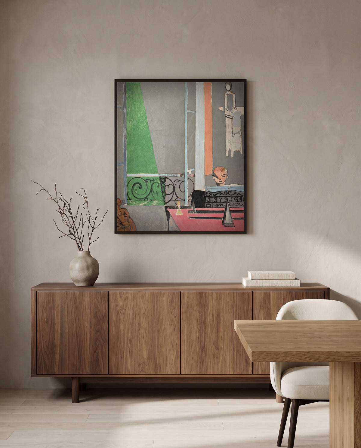 The Piano Lesson by Henri Matisse in a black frame above a walnut sideboard in a dining room