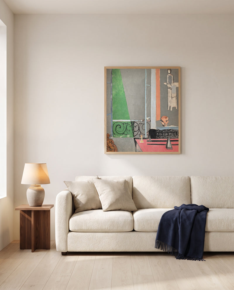 The Piano Lesson by Henri Matisse framed in natural oak above a cream sofa in a warm living room