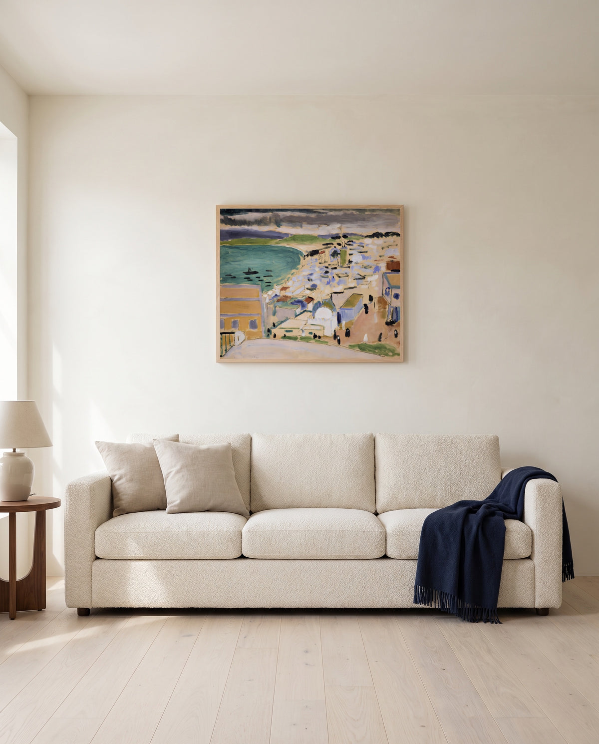 Bay of Tangier by Henri Matisse framed in natural oak above a cream sofa in a warm living room
