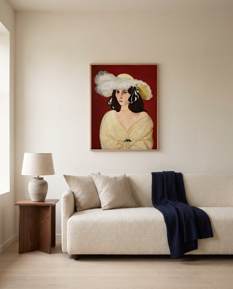 White Plumes by Henri Matisse framed in natural oak above a cream sofa in a warm living room